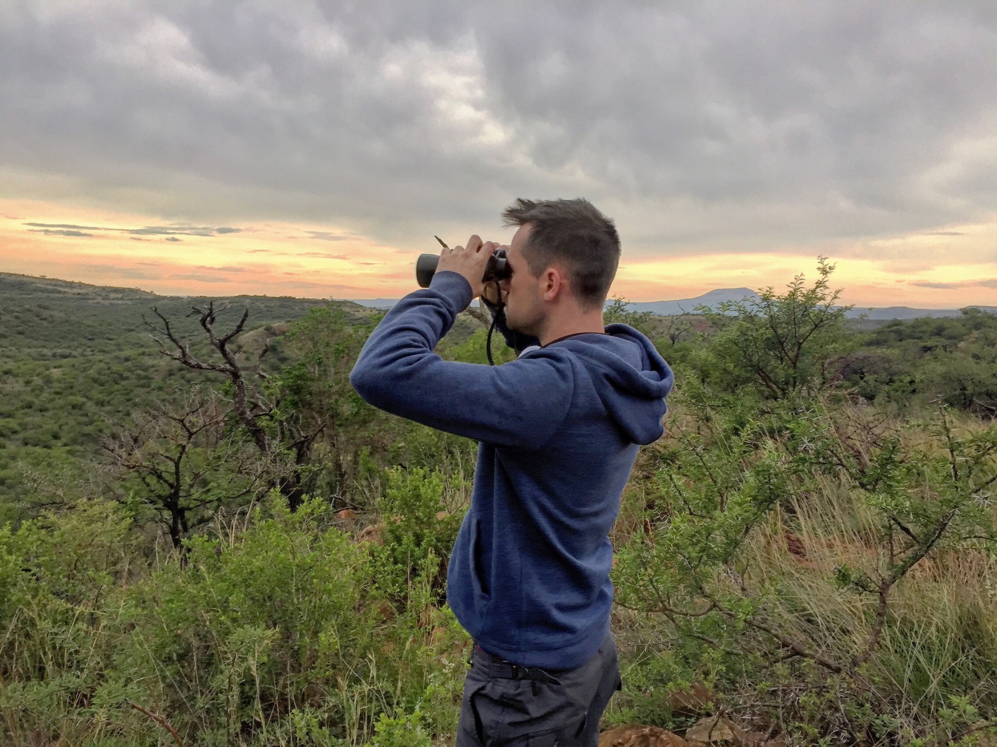 Looking through binoculars on safari south africa