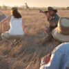 People watching giraffe on safari, Stellenbosch, South Africa