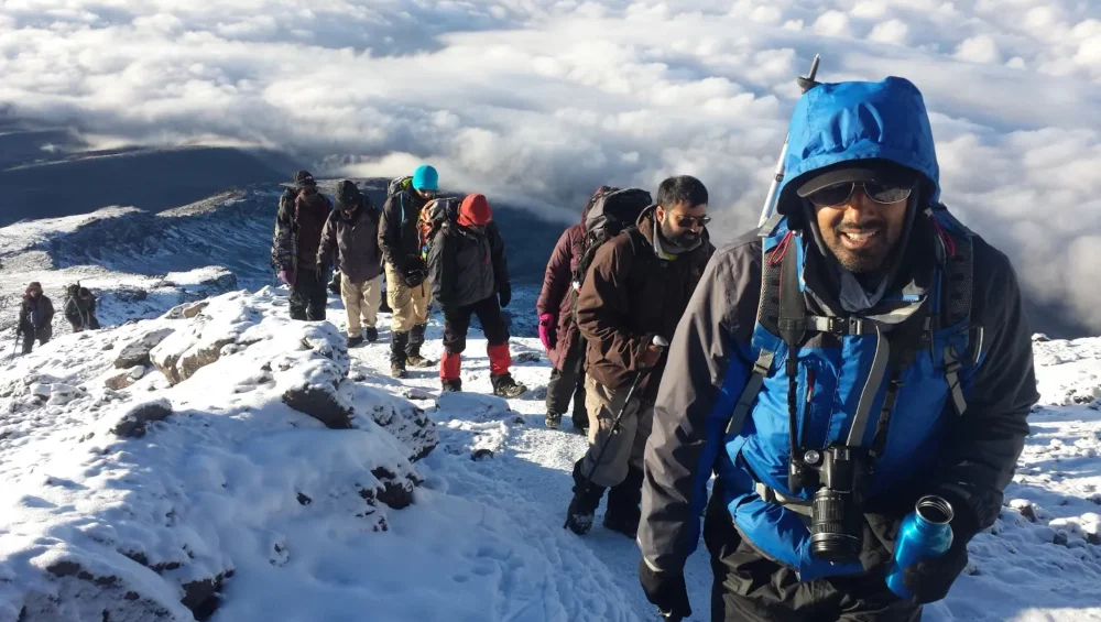 trekkers climbing mt kilimanjaro